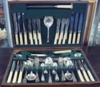 An oak cased cutlery set with set of silver plated cutlery