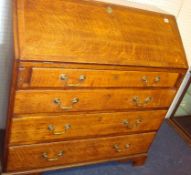 An oak bureau with fitted interior four long drawers, 104cm wide