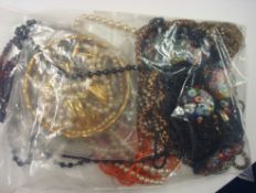 Bag of various beads, necklaces, costume jewellery