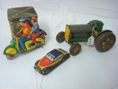 Three tin plate toys including motorcycle together with a tin plate box (4)