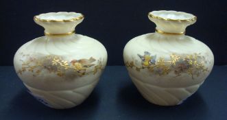Pair of Royal China Works, Worcester, posy pots each decorated with birds on gilt branches, 10cm