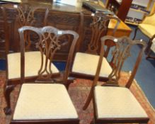 Set of four mahogany framed dining chairs of Chippendale design with claw and ball feet