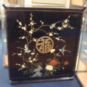 A 20th century Chinese black lacquered side cabinet decorated with exotic birds and flowers, 97cm