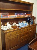 Large 20th century oak dresser with open upper section, the base fitted with six drawers and two