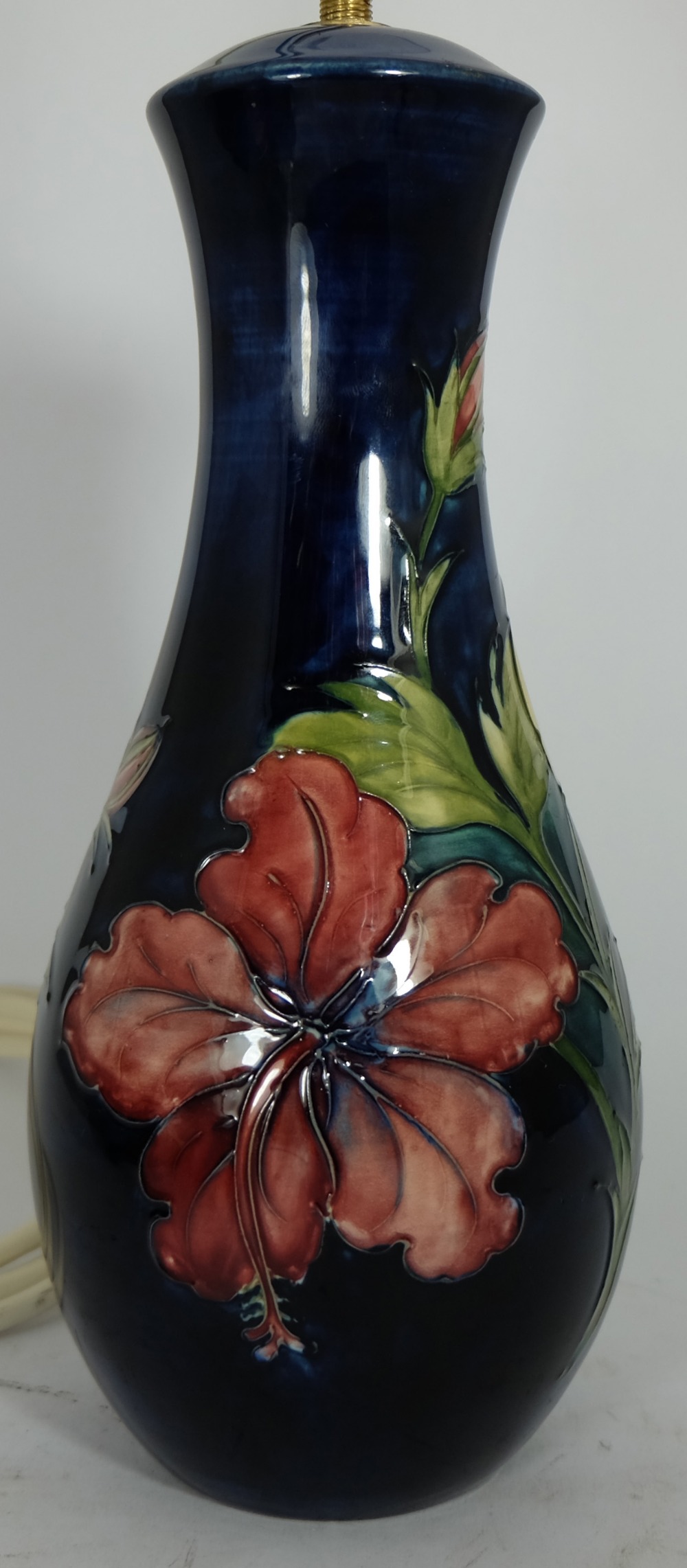 Moorcroft lamp base decorated in the hibiscus design, height 29cm