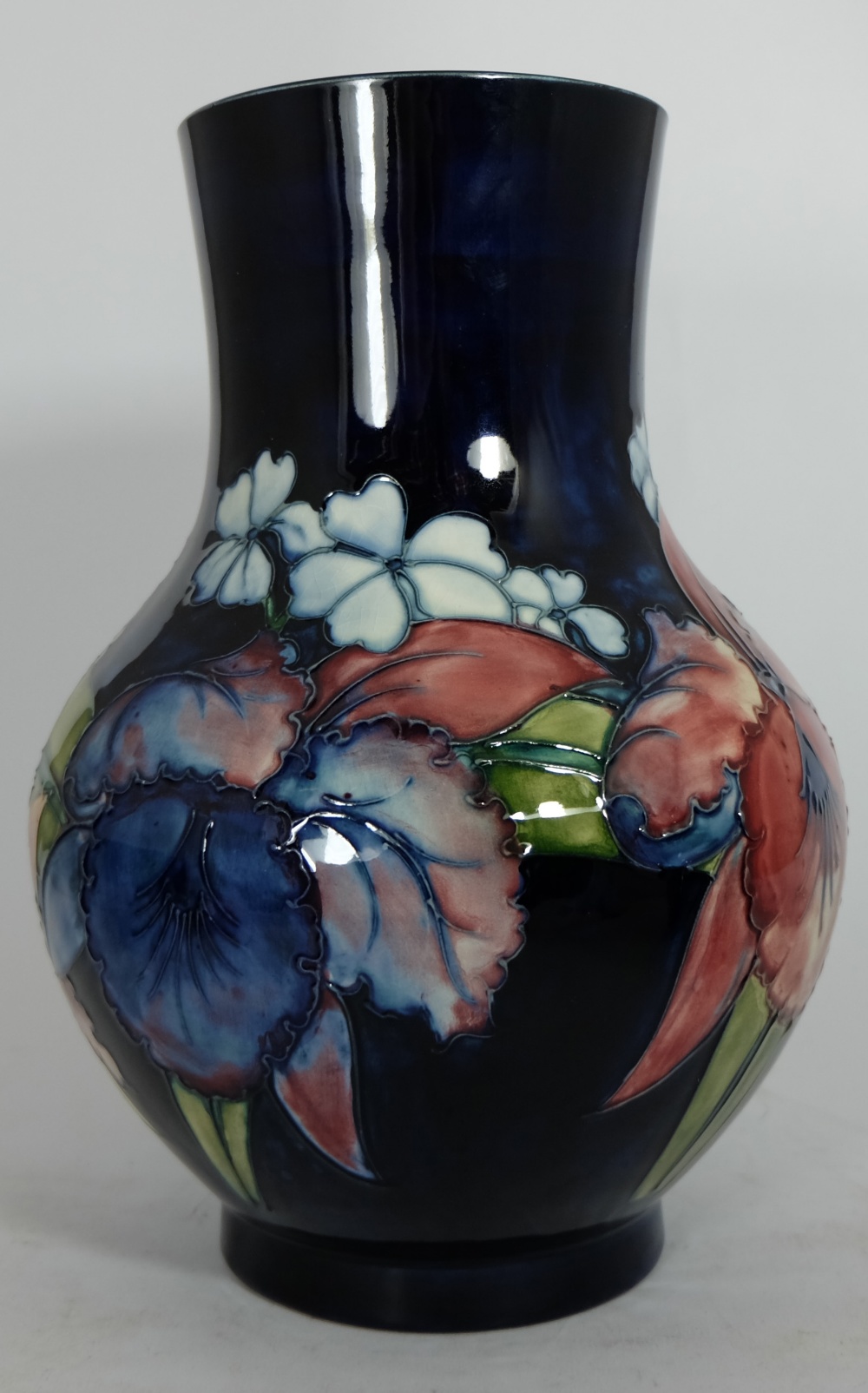 Moorcroft large vase decorated in the orchid design, signed Walter Moorcroft, height 26cm