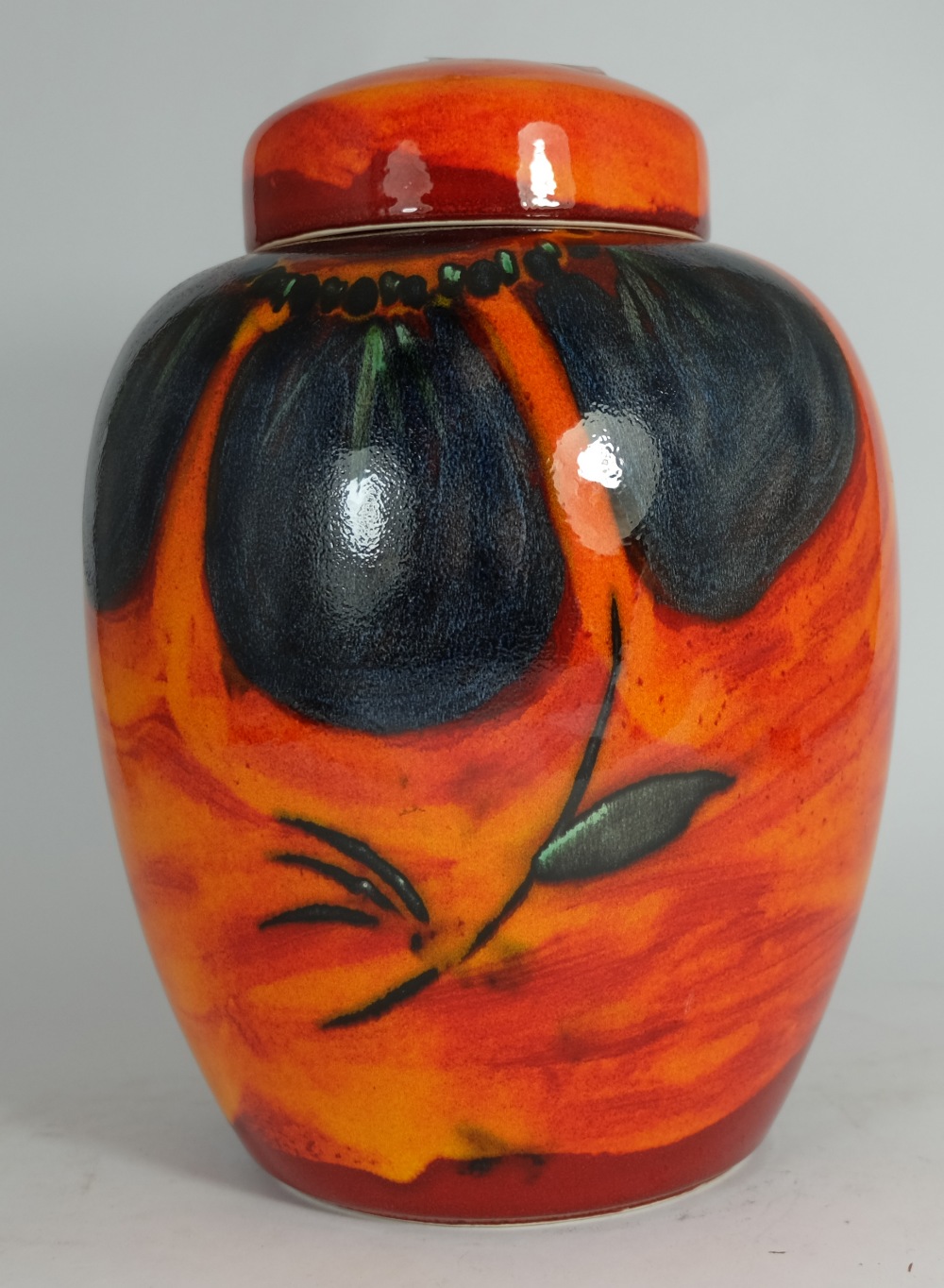 Poole pottery Ginger Jar & cover decorated in orange red and blue colours, height 24cm