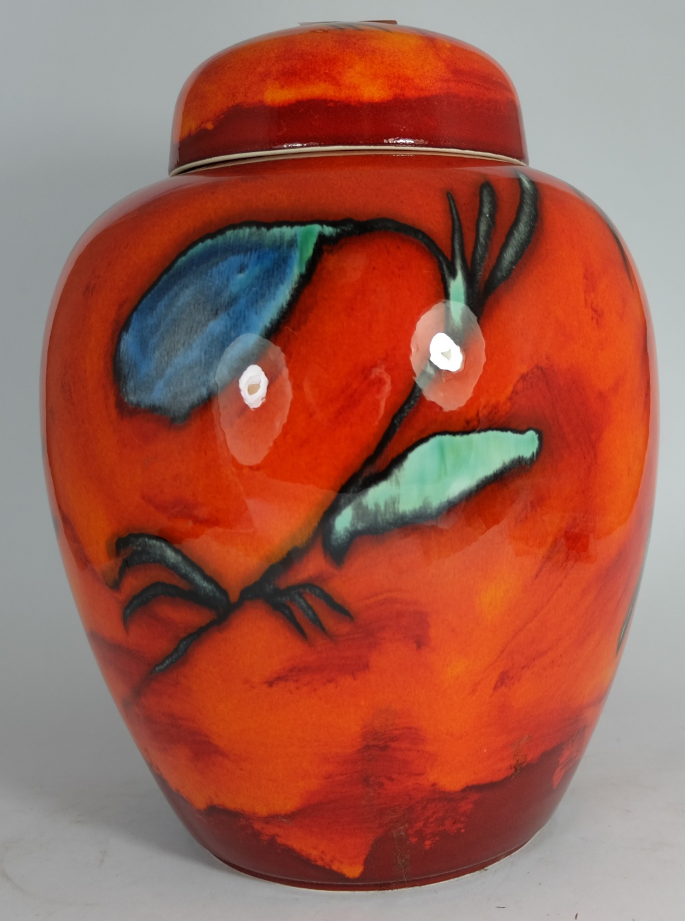 Poole pottery Ginger Jar & cover decorated in orange red and blue colours, height 31cm