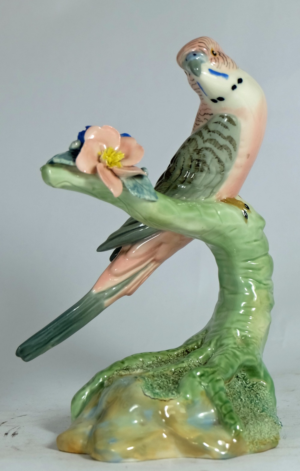 Wade underglaze model of a Budgerigar on floral branch modeled by Faust Lang, height 19cm  (small