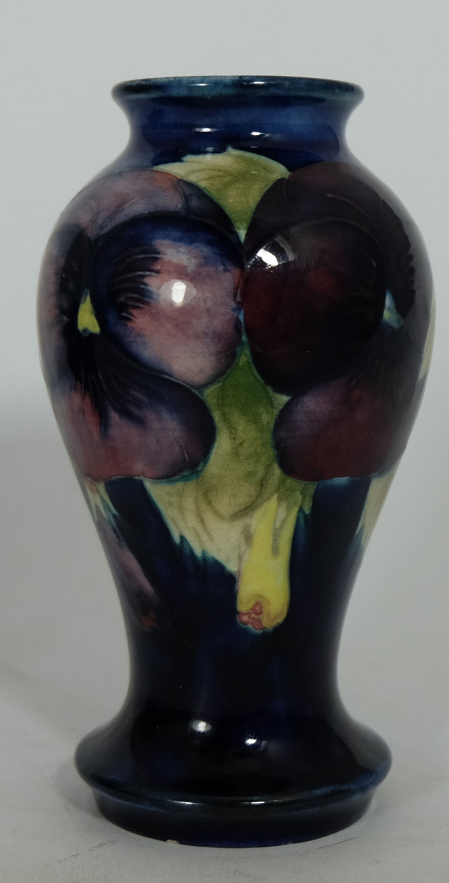 Moorcroft small vase decorated in the big poppy design, height 10cm