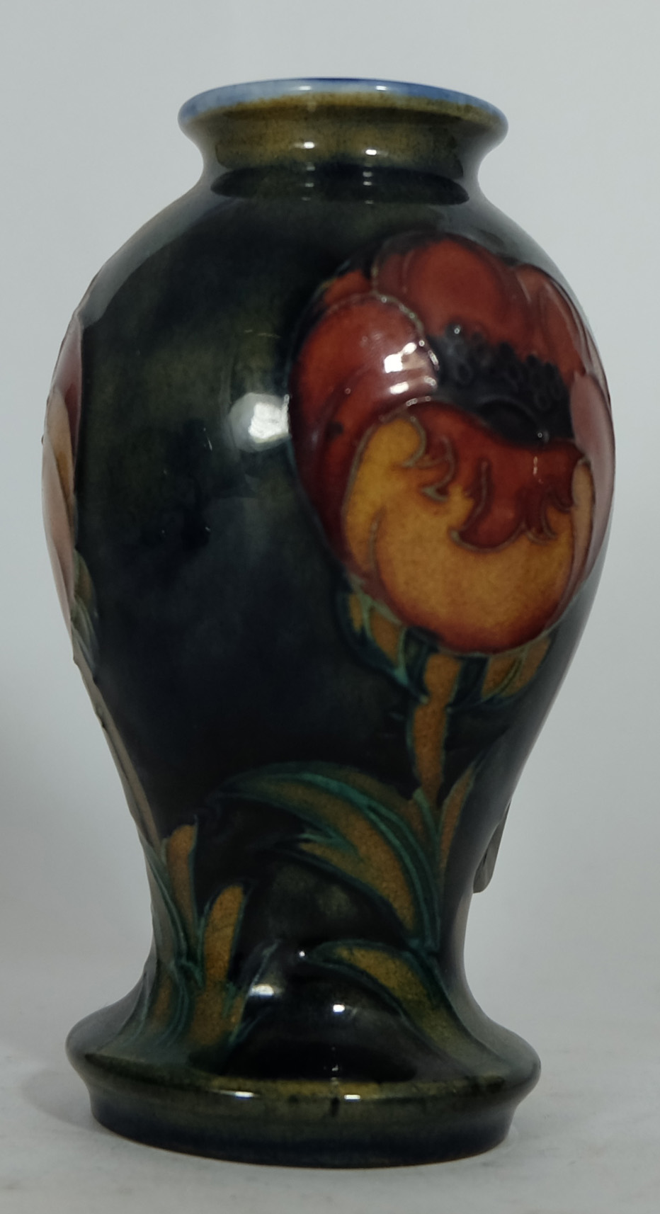 Moorcroft small vase decorated in the Big Poppy design, height 10.75cm