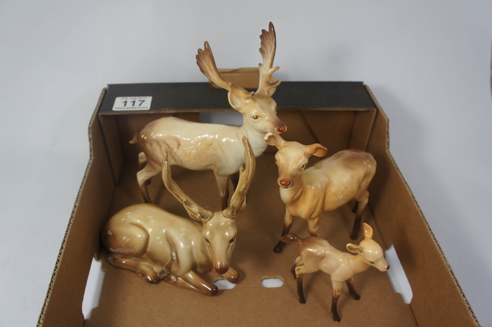 Beswick Deer Family comprising Seated Stag 954, Stag Standing (antlers re stuck), Doe (leg re stuck)