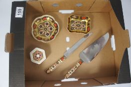 A collection of Royal Crown Derby trinket boxes (seconds) and serving knife and slice (5)