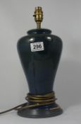 A Cobridge stonewear high fired blue lamp base on wooden stand height 38cm (some damage to wood