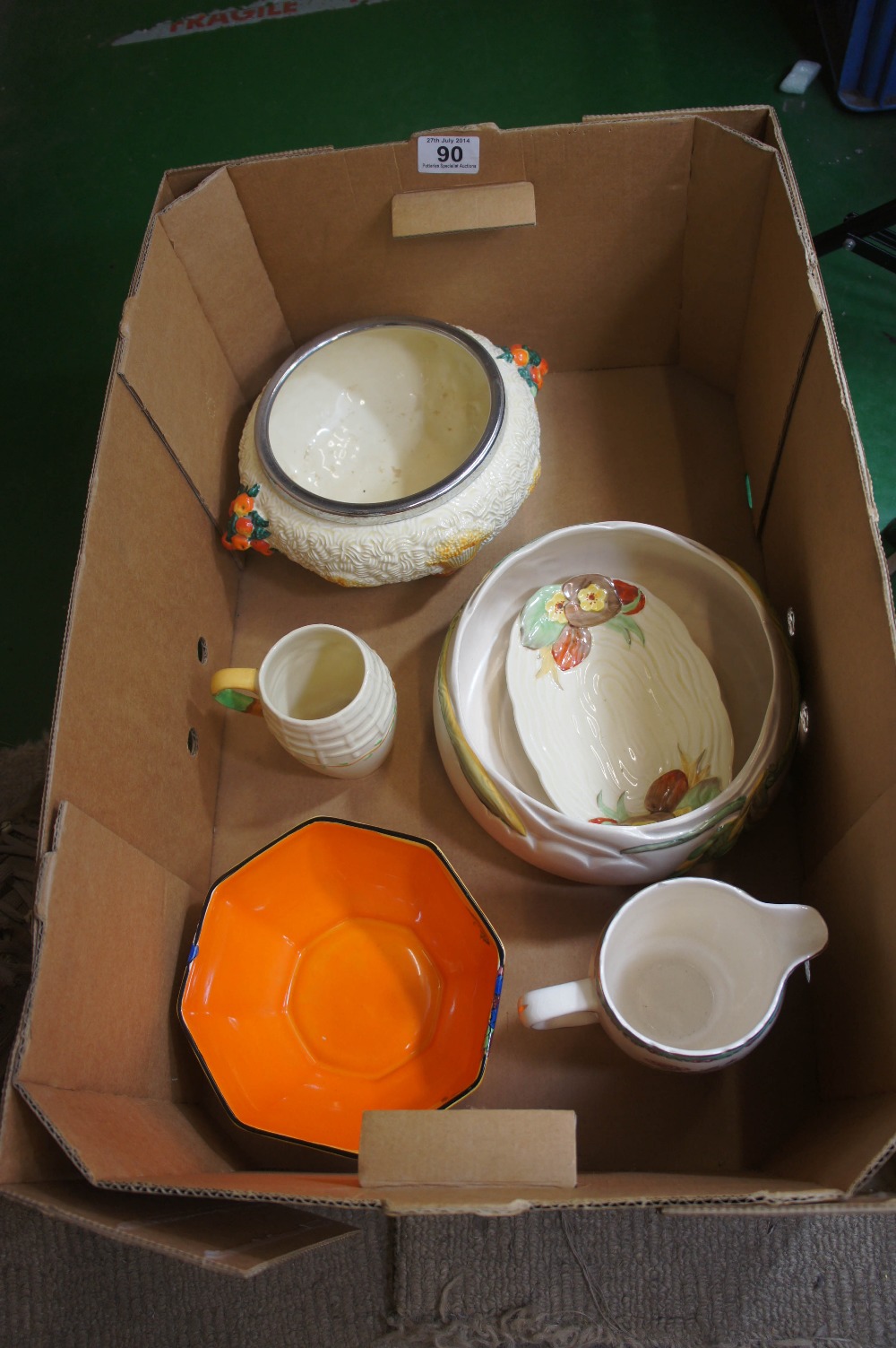A collection of Clarice Cliff pottery to include Newport Pottery Bowl with embossed floral