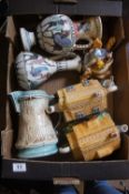 A collection of pottery to include character teapots, Burleighware coronation jug etc
