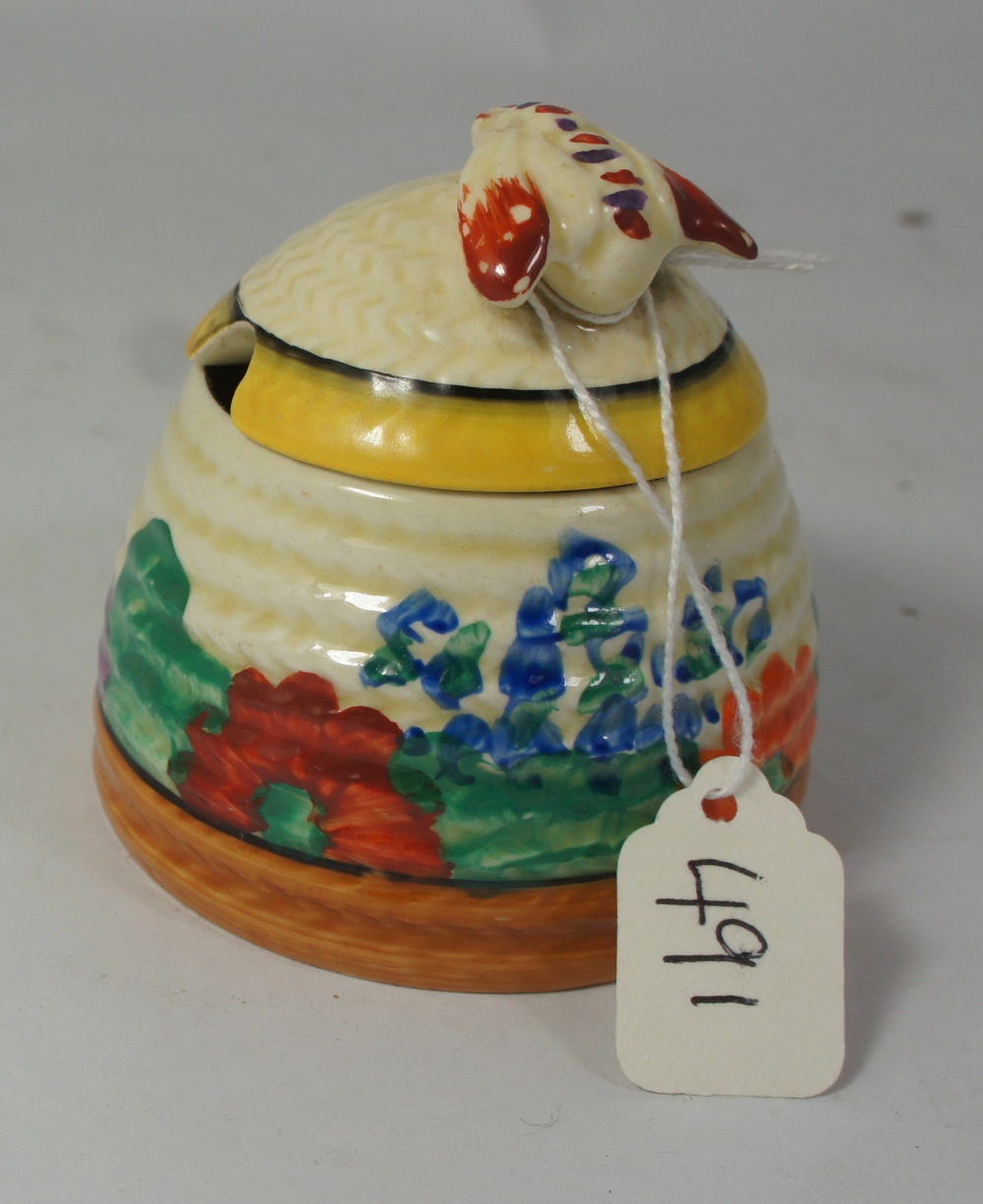Clarice Cliff Wilkinsons small honey jar & cover in the Gayday design, height 7cm