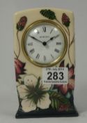 Moorcroft mantle clock decorated with flowers dated 2010 height 16cm (seconds)