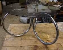 A stainless steel glass top coffee table