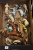A collection of various pottery animals to include Royal Doulton, Beswick, Wade and Goebal  etc (