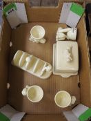 A collection of advertising pottery Lurpack egg cups, toast rack and butter dish etc