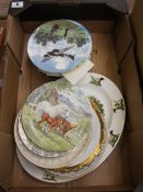 A collection of Royal Doulton collectors plates "Heroes of the sky" with wooden wall display rack