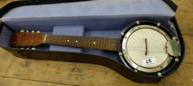 Old Banjo in original case, length 57cm