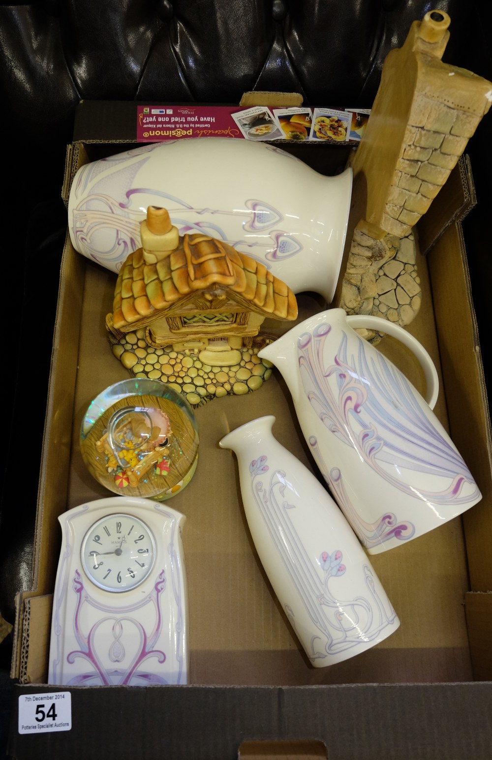 A collection of pottery to include art nouveau style vases, jugs, clock, Pendelfin houses etc