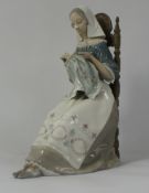 Lladro large figure of a Woman seated on chair doing crochet , height 28cm