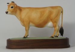 Royal Worcester Model of a Jersey Cow Modeled by Doris Lindler on ceramic base, mounted on wooden
