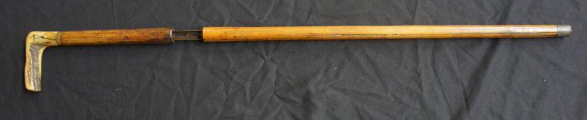 A rare bamboo and bone rifle walking stick marked Dumontheir B.S.GD.G, length 83cm