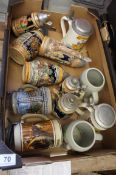 A Collection of Various German Embossed Porcelain Beer Steins with metal mounts and lids (12)