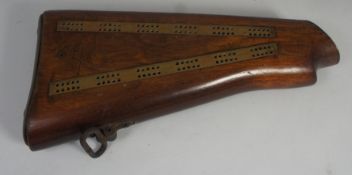 A Rifle Butt made into a card scoring pin board, enscribed brass plaque "I CORPS TRP WKSPS REME