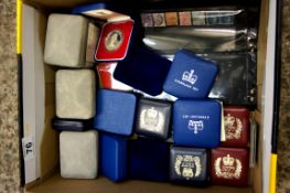 A Collection of various boxed coins to include 1977 Jubilee appeal crowns, Isle of Man £1 coins,
