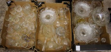 A collection of glassware to include cake stand, glasses, candlesticks, etc (3 trays)
