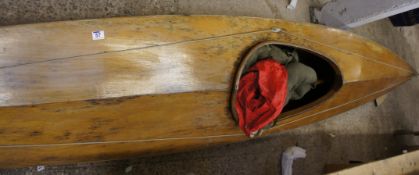 Large wooden canoe with adjustable seat, oars and old life jacket, overall length 440cm