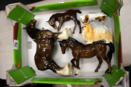 A collection of Beswqick horses (damaged), Royal Doulton Terrier with ball and unmarked Pekenese