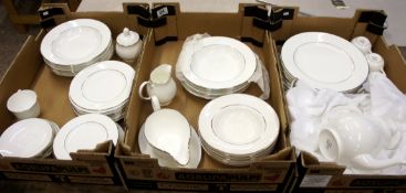 A collection of unused Royal Doulton signature platinum dinnerware to include plates, side plates,
