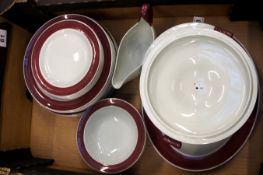 A collection of Wedgoowd Grey and Burgendy dinnerware to consist of plates, servers, taurens, bowls,