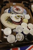 A collection of various pottery to include collectors plates, commemorative mugs etc