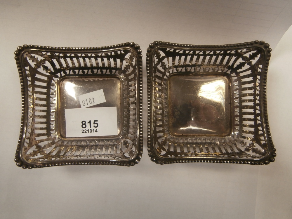 Pair pierced square silver baskets
