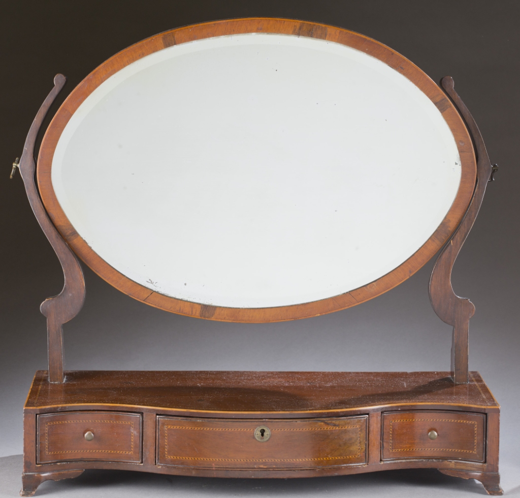 A Federal style inlaid dressing mirror. First quarter 19th century. Mahogany serpentine drawer