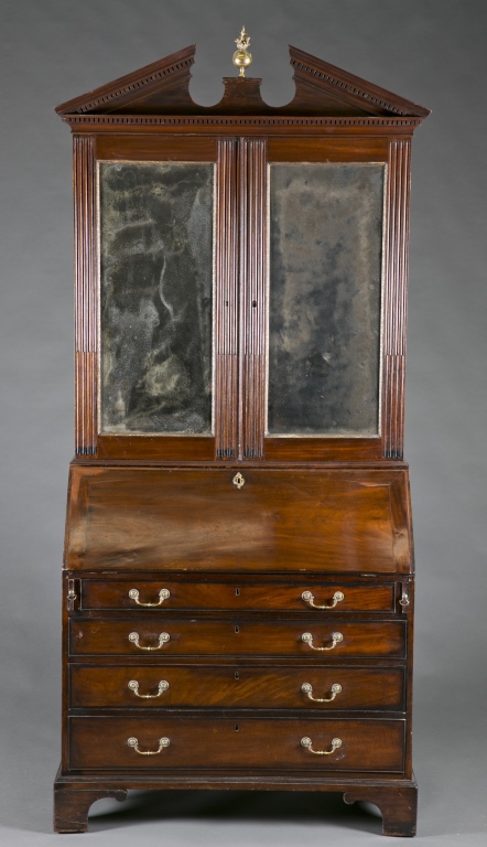 A Chippendale style secretary. 19th c. Attributed to James Hicks of Dublin. Incorporating fine