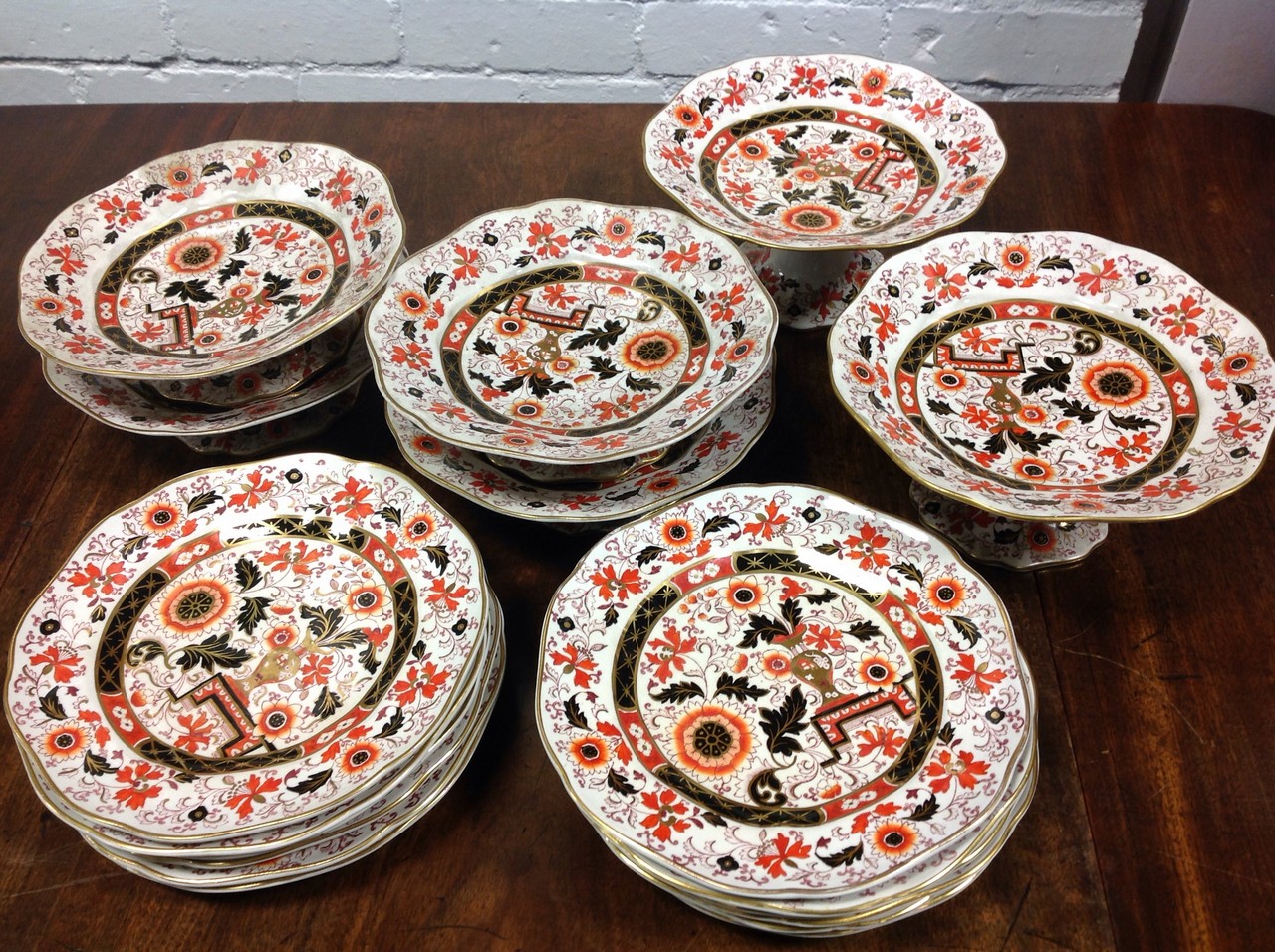 A Victorian Ironstone dessert service with two comports, four tazzas and twelve plates, all