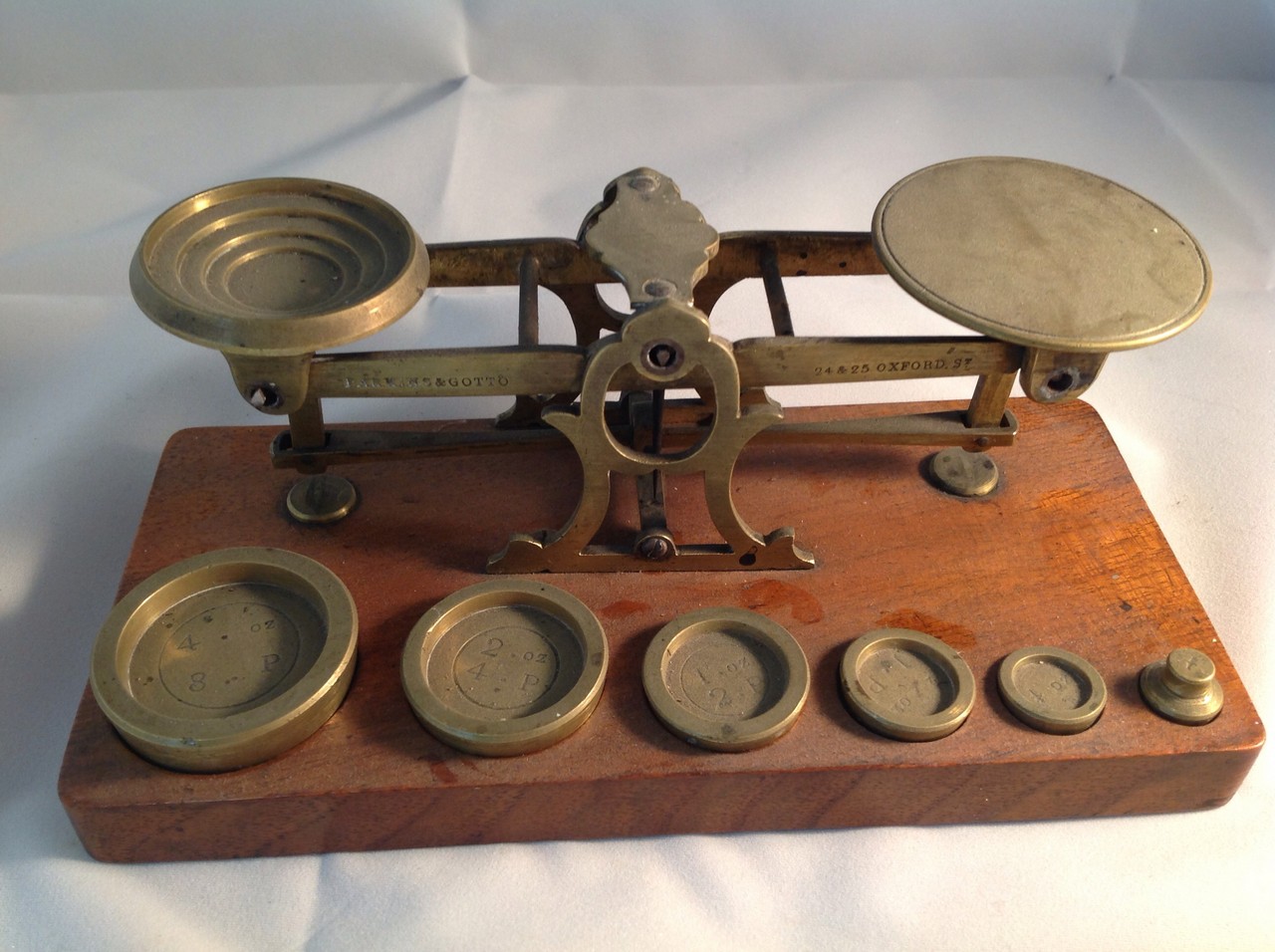 A set of Victorian postal scales by Parkins & Gotto, 24/25 Oxford Street, the complete set with