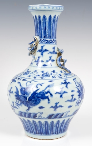 Chinese blue and white vase with coiled dragon to neck and painted mythical beast and floral