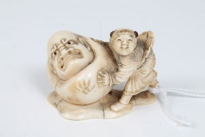 Three late 19th century Japanese carved ivory okimono of a warrior on a demon's back, boy with large - Image 2 of 8