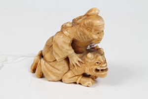 Three late 19th century Japanese carved ivory okimono of a warrior on a demon's back, boy with large - Image 4 of 8