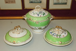 Large early nineteenth century Derby tureen and cover, painted with apple green border and botanical