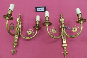 Set four neoclassical-style gilt brass electric wall sconces with twin branches and urn finials,